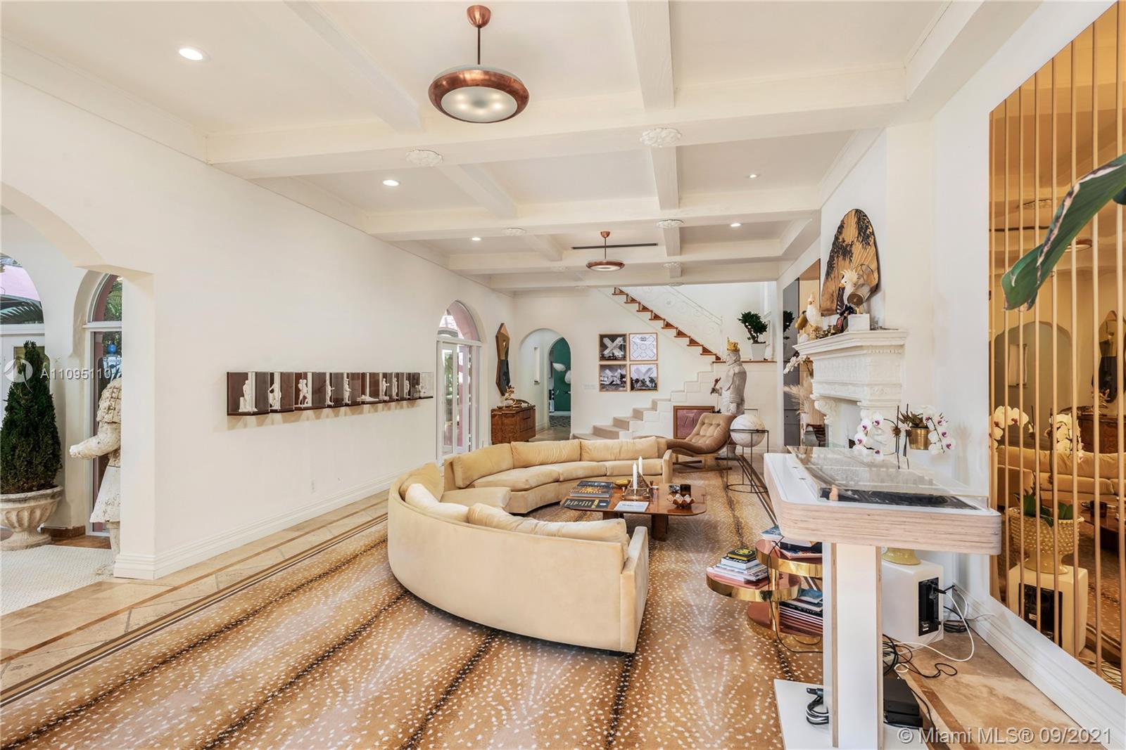 5454 Pine Tree Drive Miami Beach, FL 33140 - Photo 5 of 33 a living room with lots of furniture and kitchen view