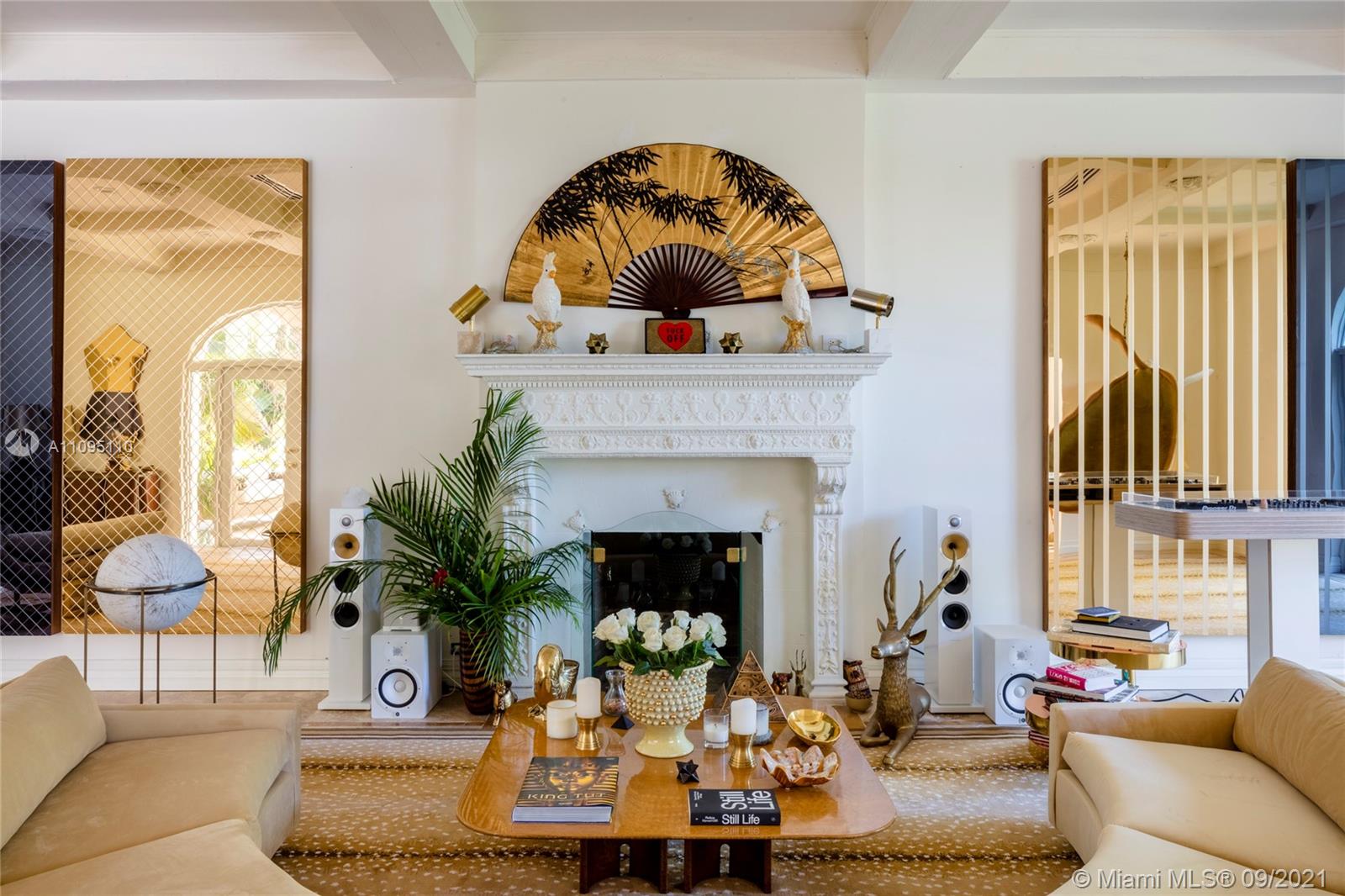 5454 Pine Tree Drive Miami Beach, FL 33140 - Photo 6 of 33 a living room with furniture and a fireplace