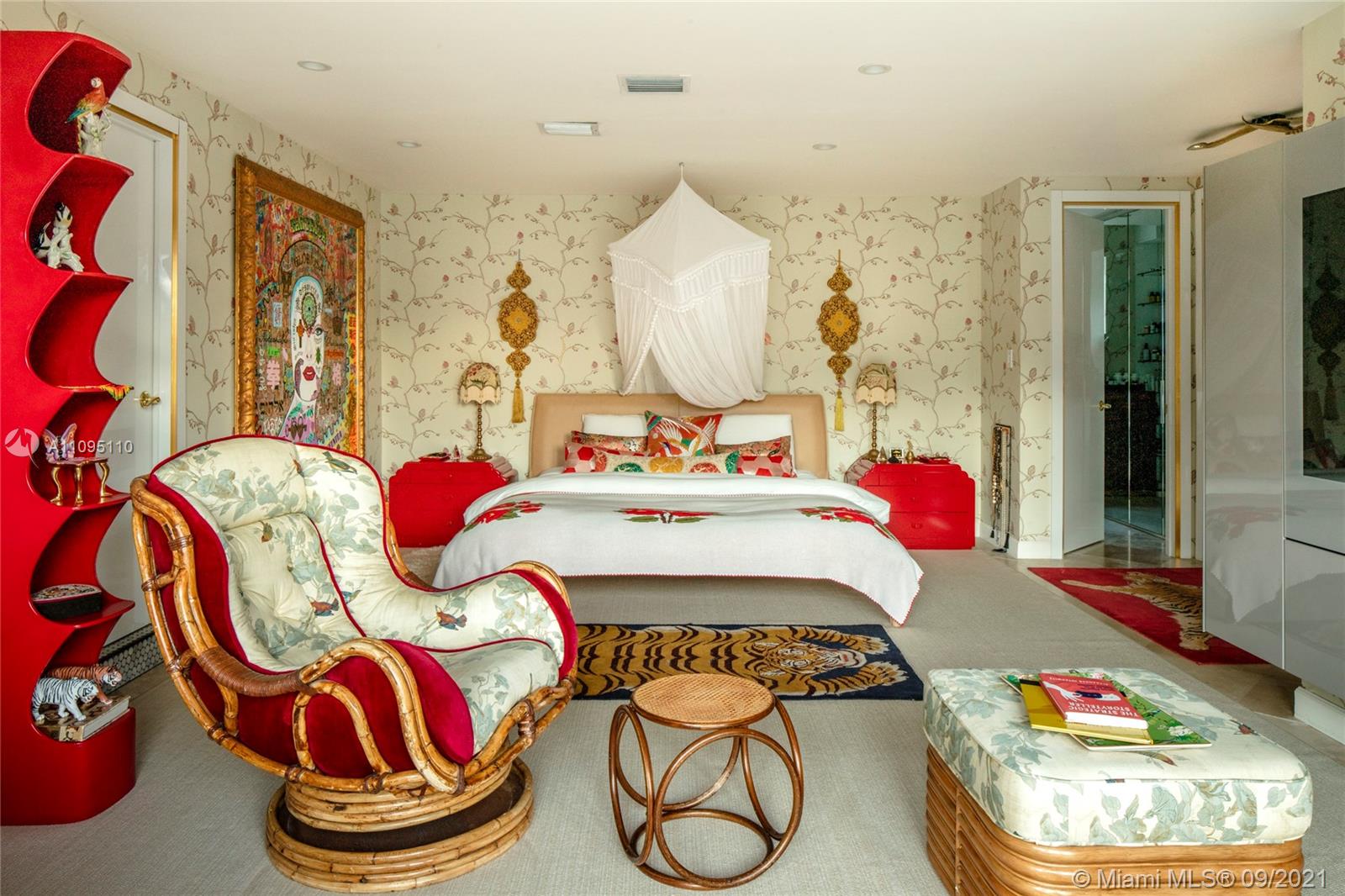 5454 Pine Tree Drive Miami Beach, FL 33140 - Photo 7 of 33 a bedroom with furniture and a wooden floor