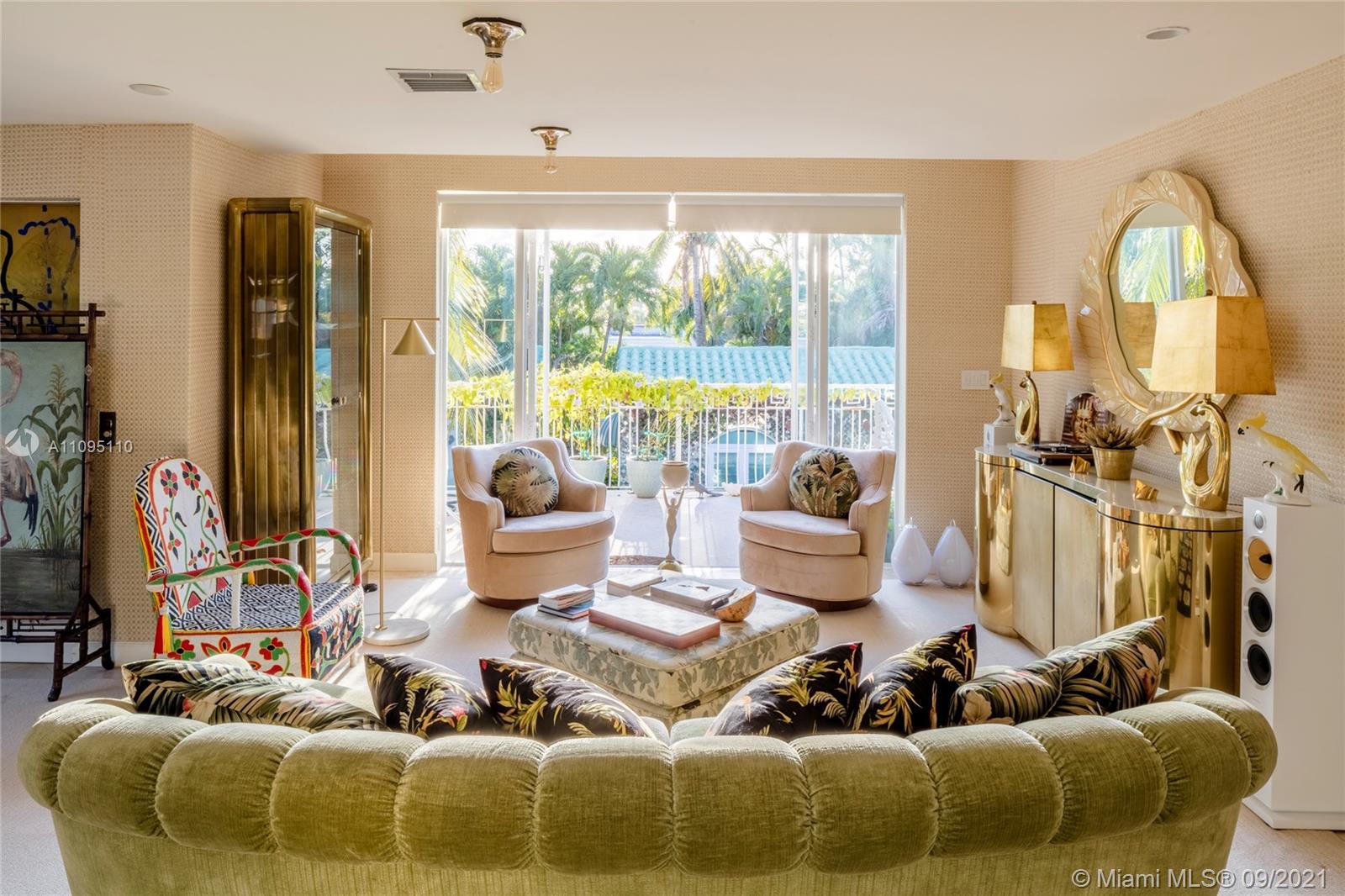 5454 Pine Tree Drive Miami Beach, FL 33140 - Photo 8 of 33 a living room with furniture and a large window