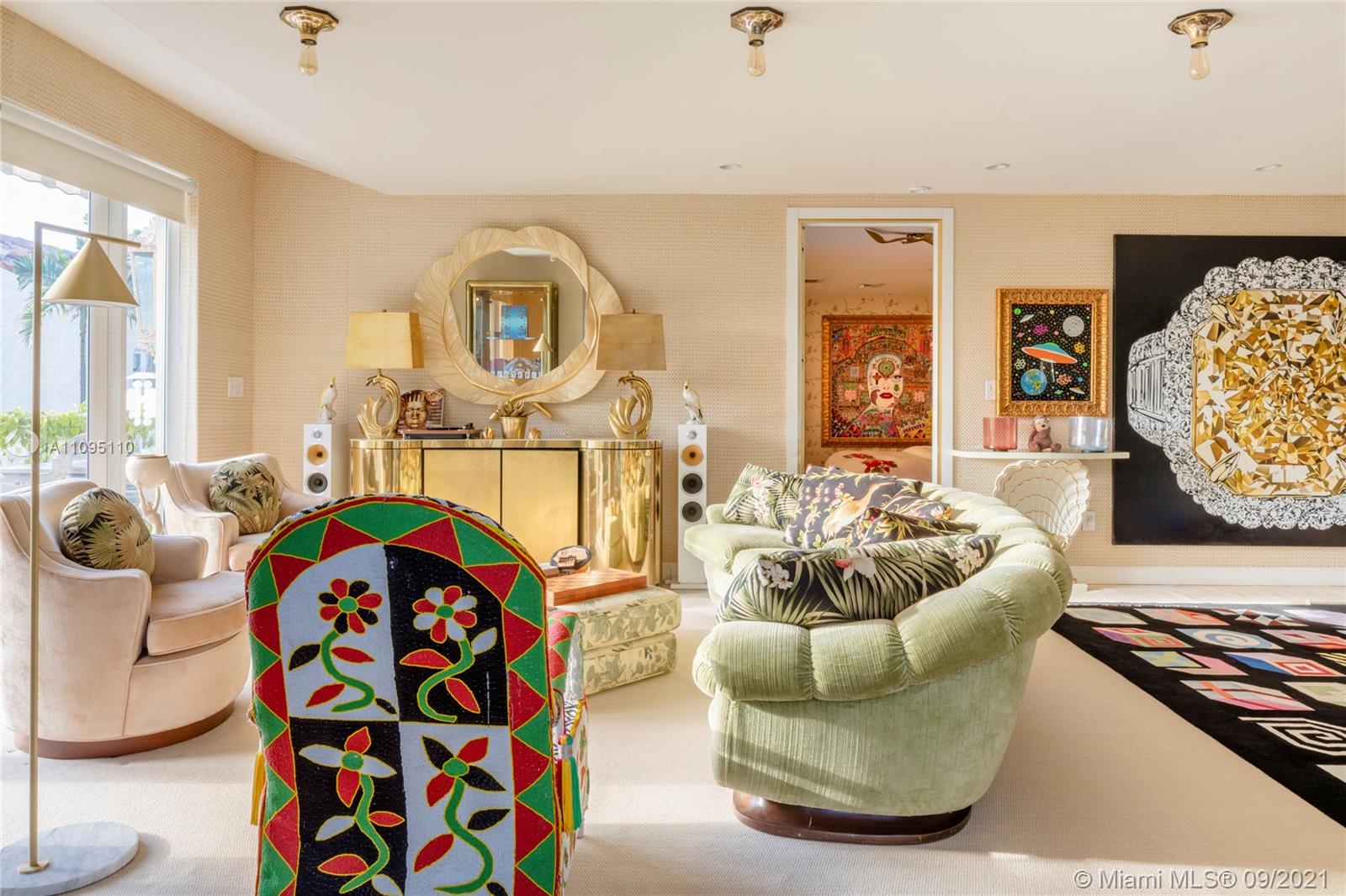 5454 Pine Tree Drive Miami Beach, FL 33140 - Photo 10 of 33 a living room with furniture and a flat screen tv