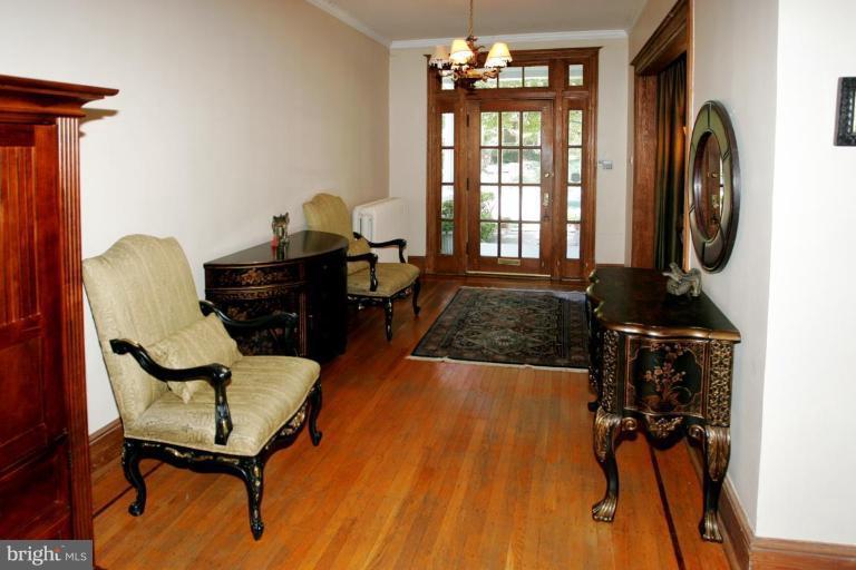 2946 Upton Street Northwest Washington, DC 20008 - Photo 2 of 22 a living room with furniture and a window