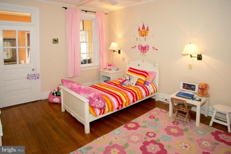 2946 Upton Street Northwest Washington, DC 20008 - Photo 11 of 22 a bedroom with a bed and a window