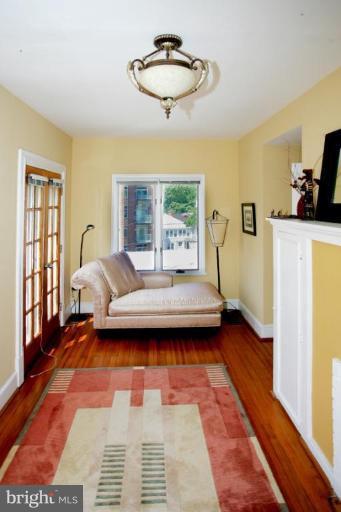 2946 Upton Street Northwest Washington, DC 20008 - Photo 16 of 22 a living room with a couch and a table