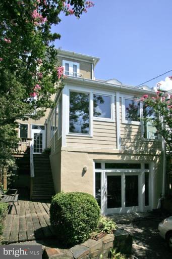 2946 Upton Street Northwest Washington, DC 20008 - Photo 20 of 22 a front view of a house with a yard