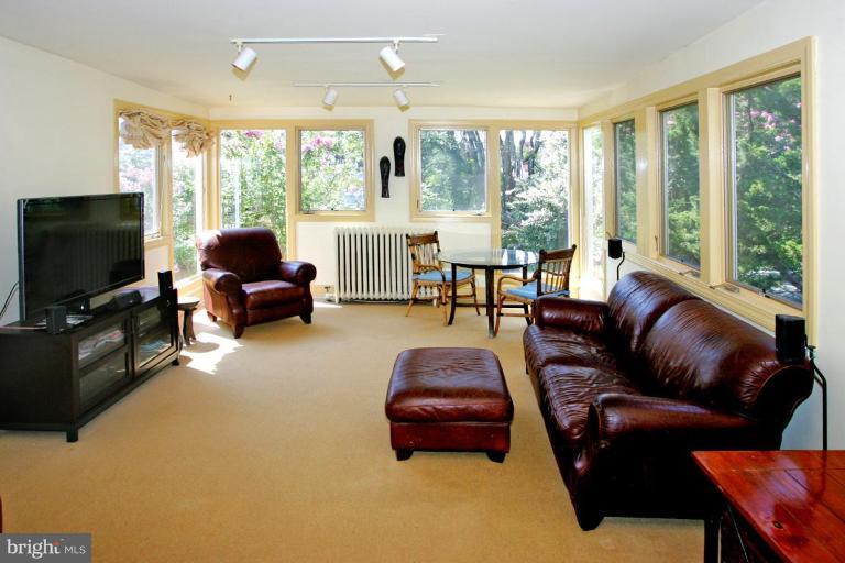 2946 Upton Street Northwest Washington, DC 20008 - Photo 8 of 22 a living room with furniture and a flat screen tv