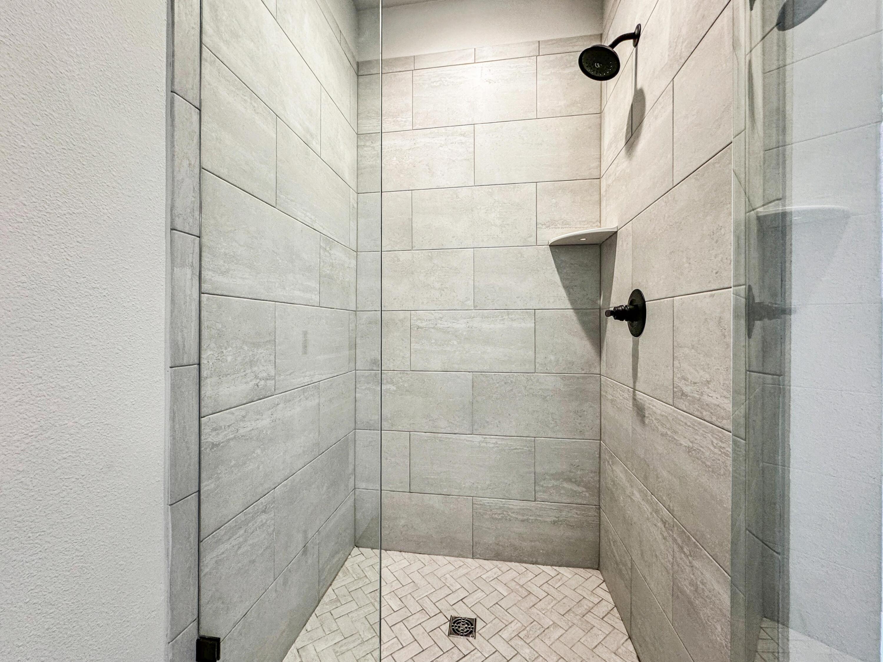 124 Apollo Avenue Freeport, FL 32439 - Photo 16 of 41 Tiled Shower - Herringbone Stonework!