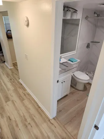a kitchen with sink stove and cabinets