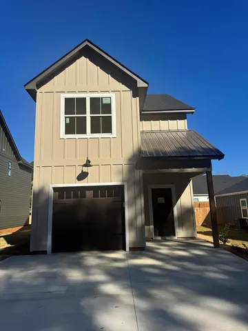 a front view of a house with garage
