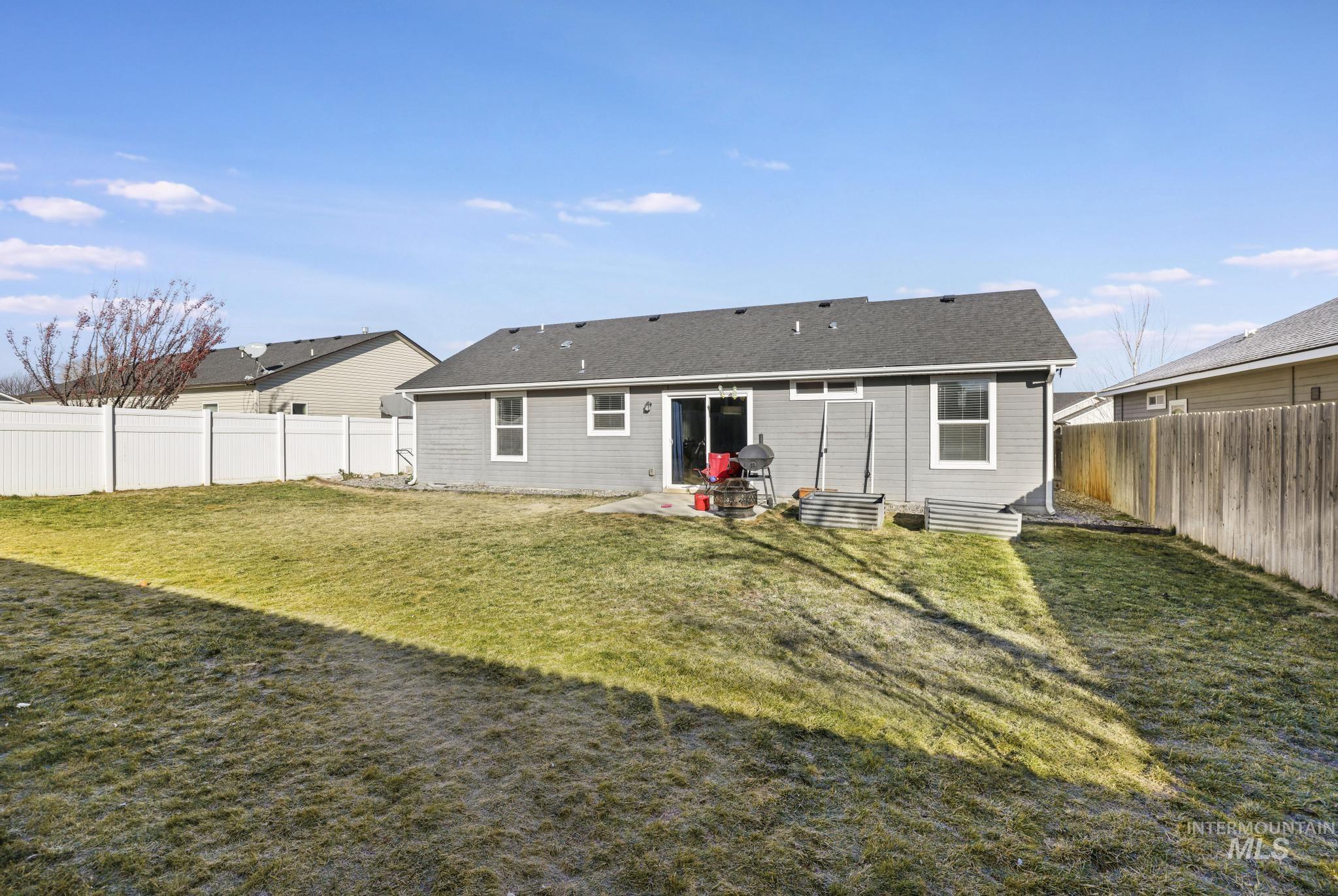 370 Feather Avenue Twin Falls, ID 83301 - Photo 12 of 17 Rear view of property with a patio and a fenced backyard