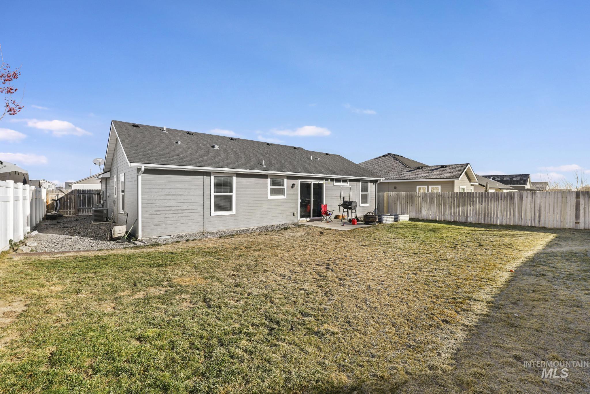 370 Feather Avenue Twin Falls, ID 83301 - Photo 14 of 17 Rear view of house featuring a patio and a fenced backyard