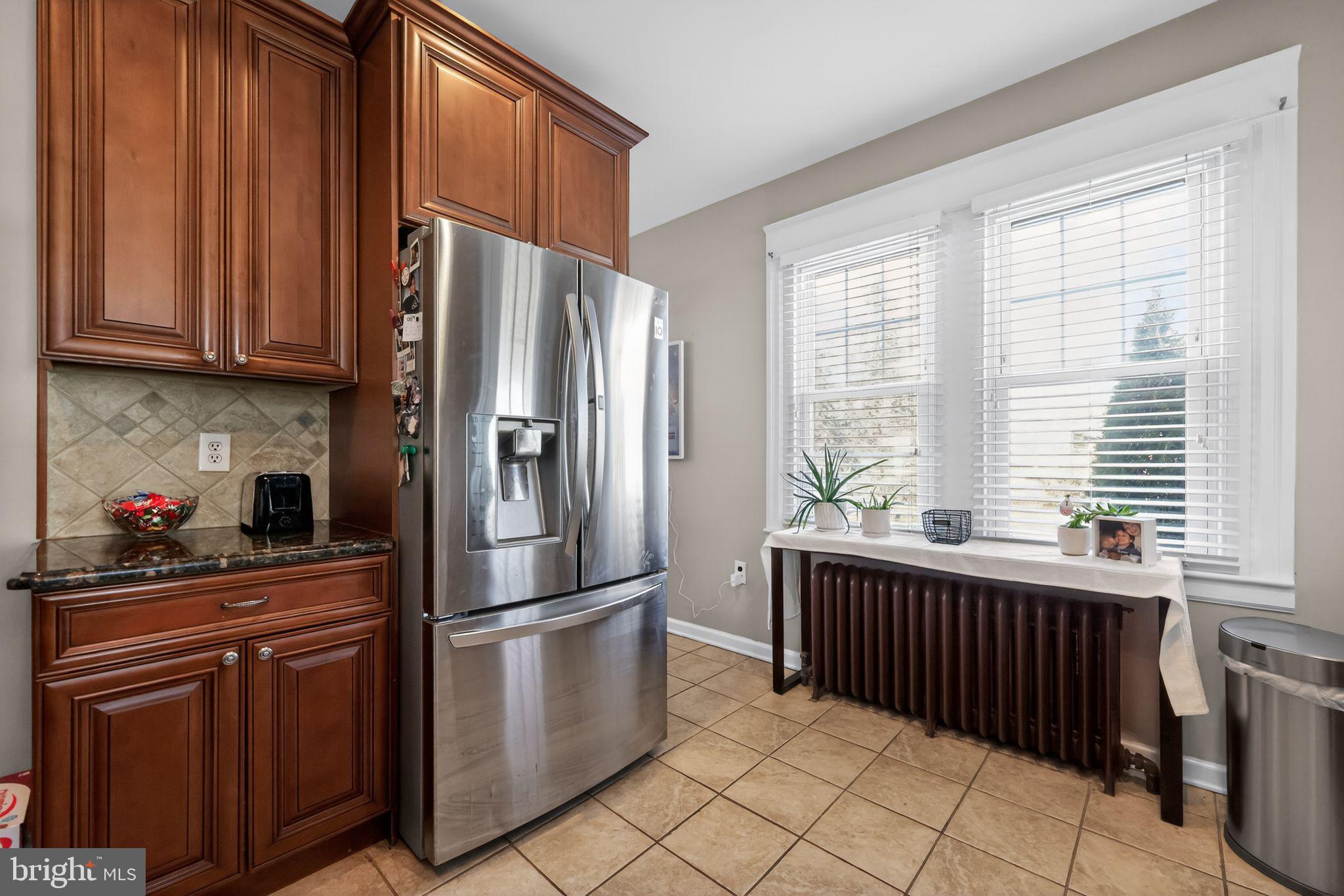 801 Chandler Street Philadelphia, PA 19111 - Photo 14 of 30 a kitchen with stainless steel appliances a refrigerator sink and cabinets