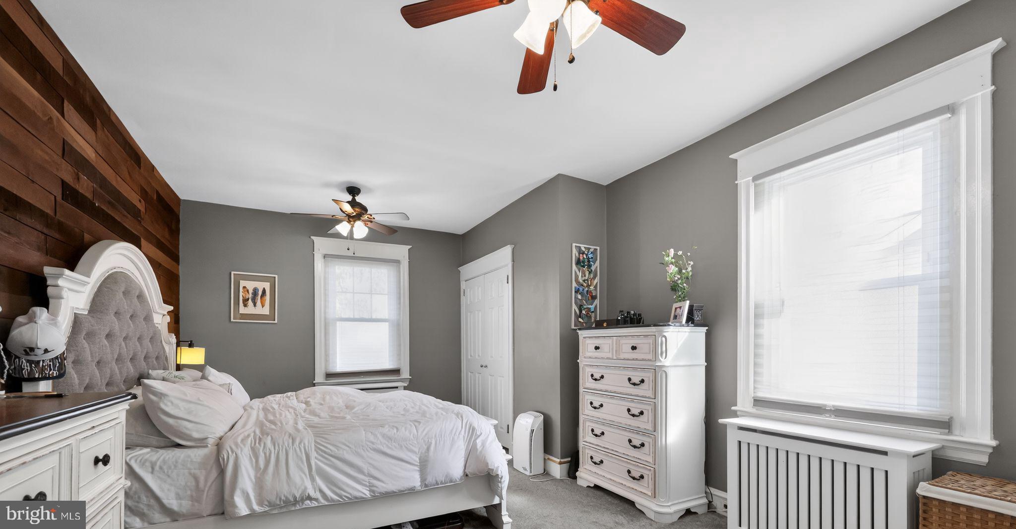 801 Chandler Street Philadelphia, PA 19111 - Photo 17 of 30 a bedroom with a bed and a chandelier