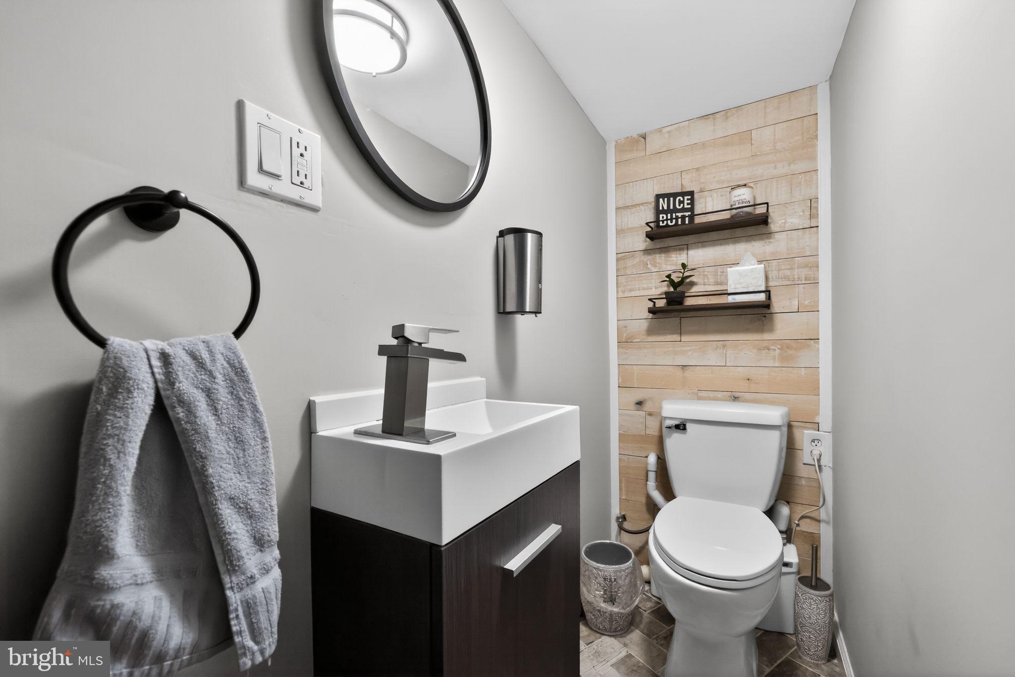 801 Chandler Street Philadelphia, PA 19111 - Photo 25 of 30 a bathroom with a toilet a sink and a mirror