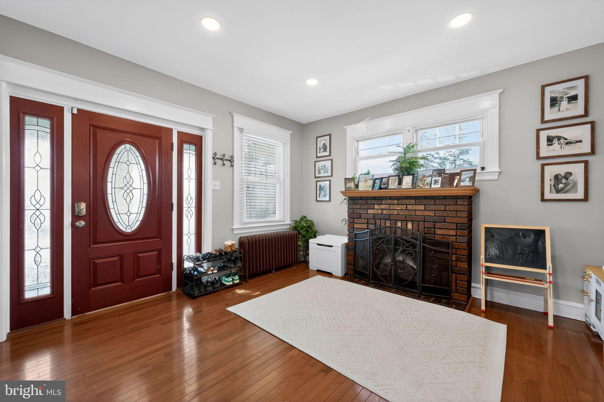801 Chandler Street Philadelphia, PA 19111 - Photo 5 of 30 a living room with furniture a fireplace and a window