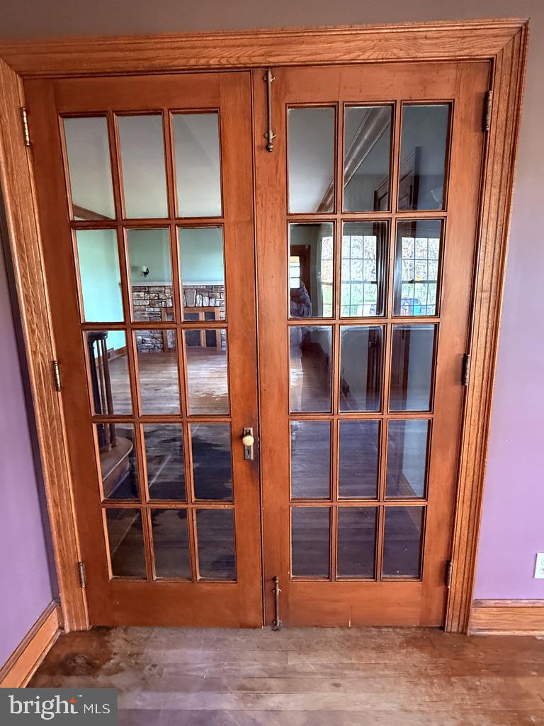6245 Middleburg Road Keymar, MD 21757 - Photo 44 of 77 a view of an empty room with wooden floor and windows
