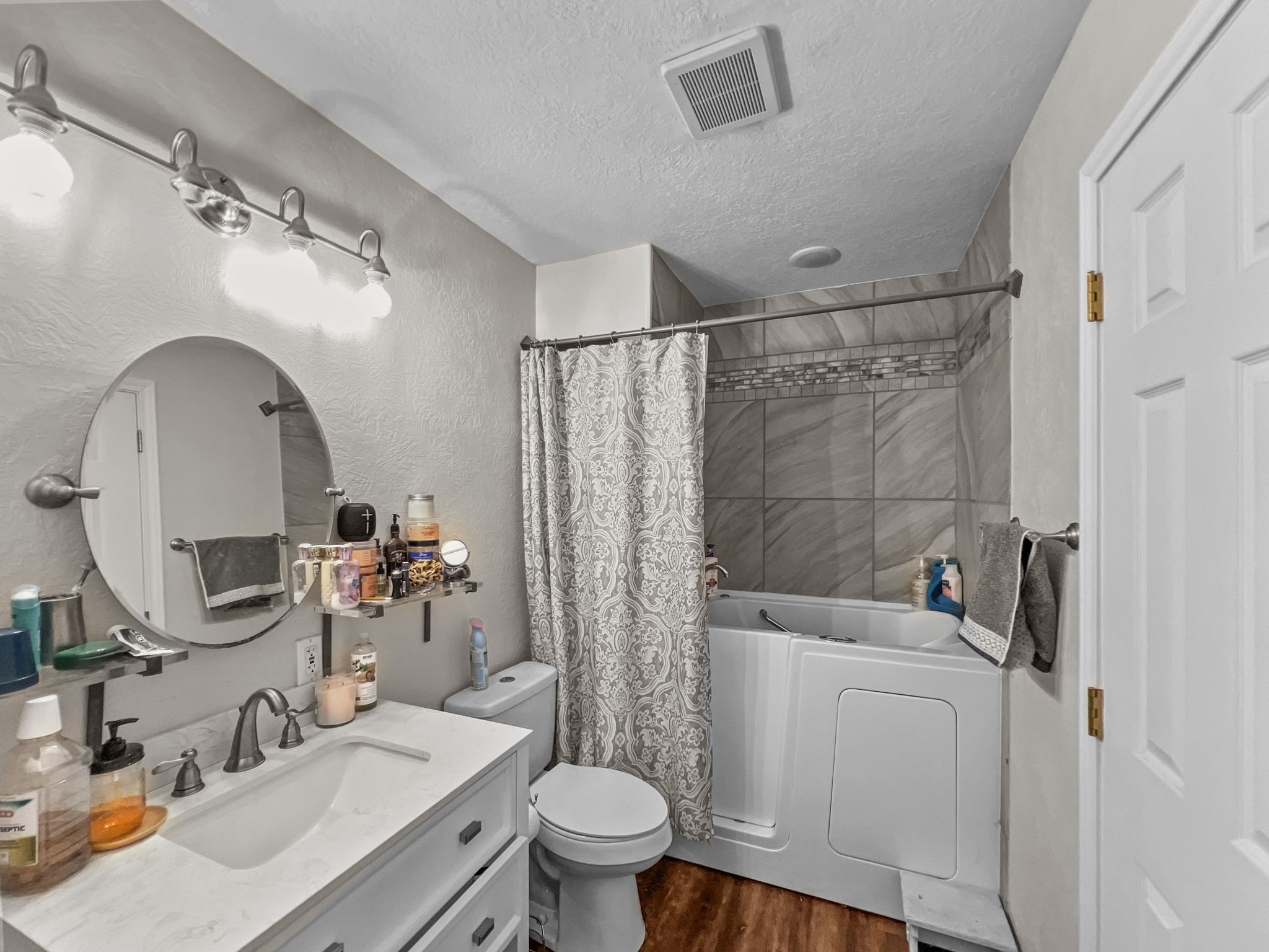 1015 Mitchell Street Sour Lake, TX 77659 - Photo 12 of 19 a bathroom with a sink toilet and shower