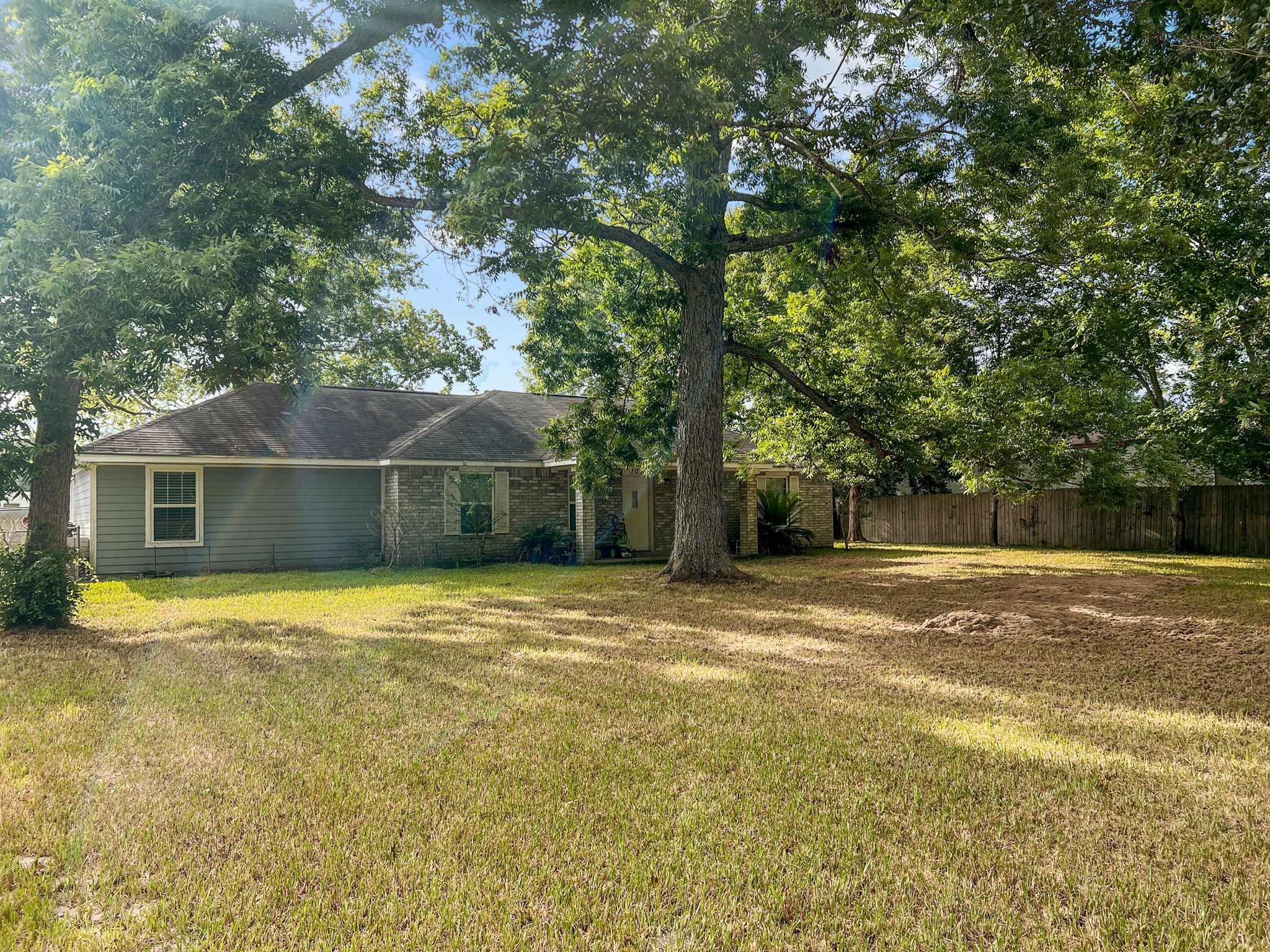 1015 Mitchell Street Sour Lake, TX 77659 - Photo 15 of 19 a view of a house with a yard