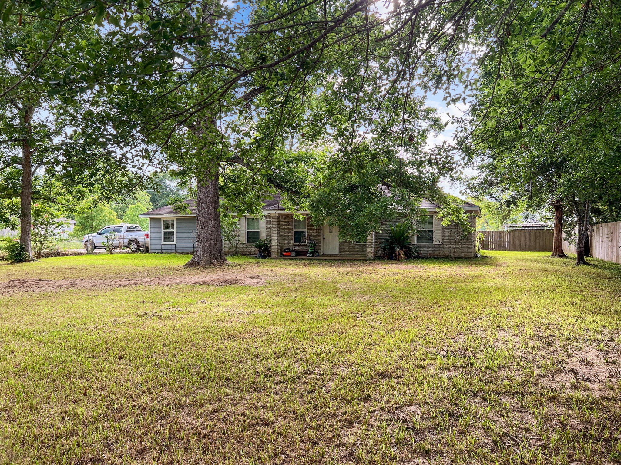 1015 Mitchell Street Sour Lake, TX 77659 - Photo 17 of 19 a view of a swimming pool with an outdoor space and seating area
