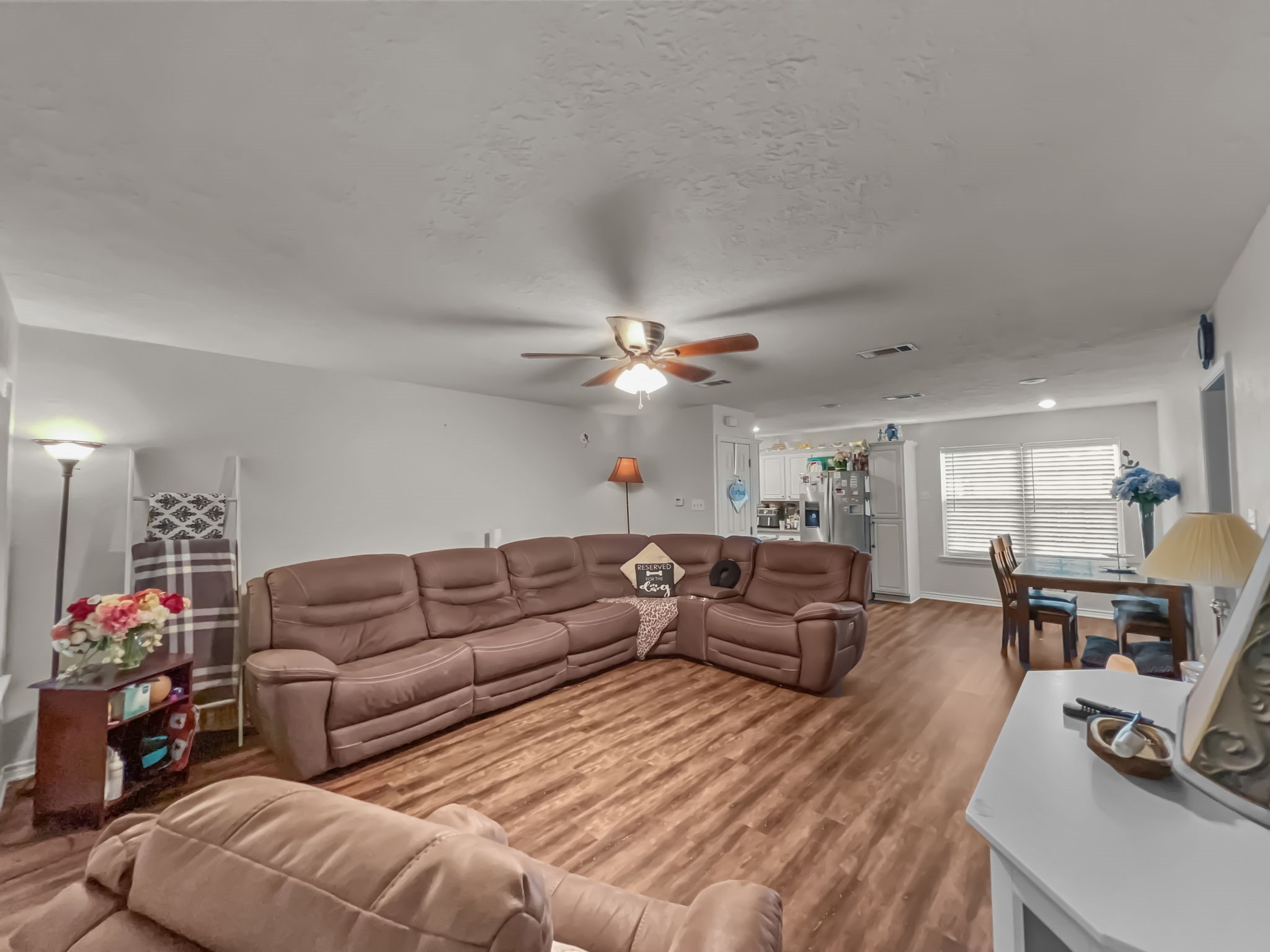 1015 Mitchell Street Sour Lake, TX 77659 - Photo 2 of 19 a living room with furniture a couch and a chandelier