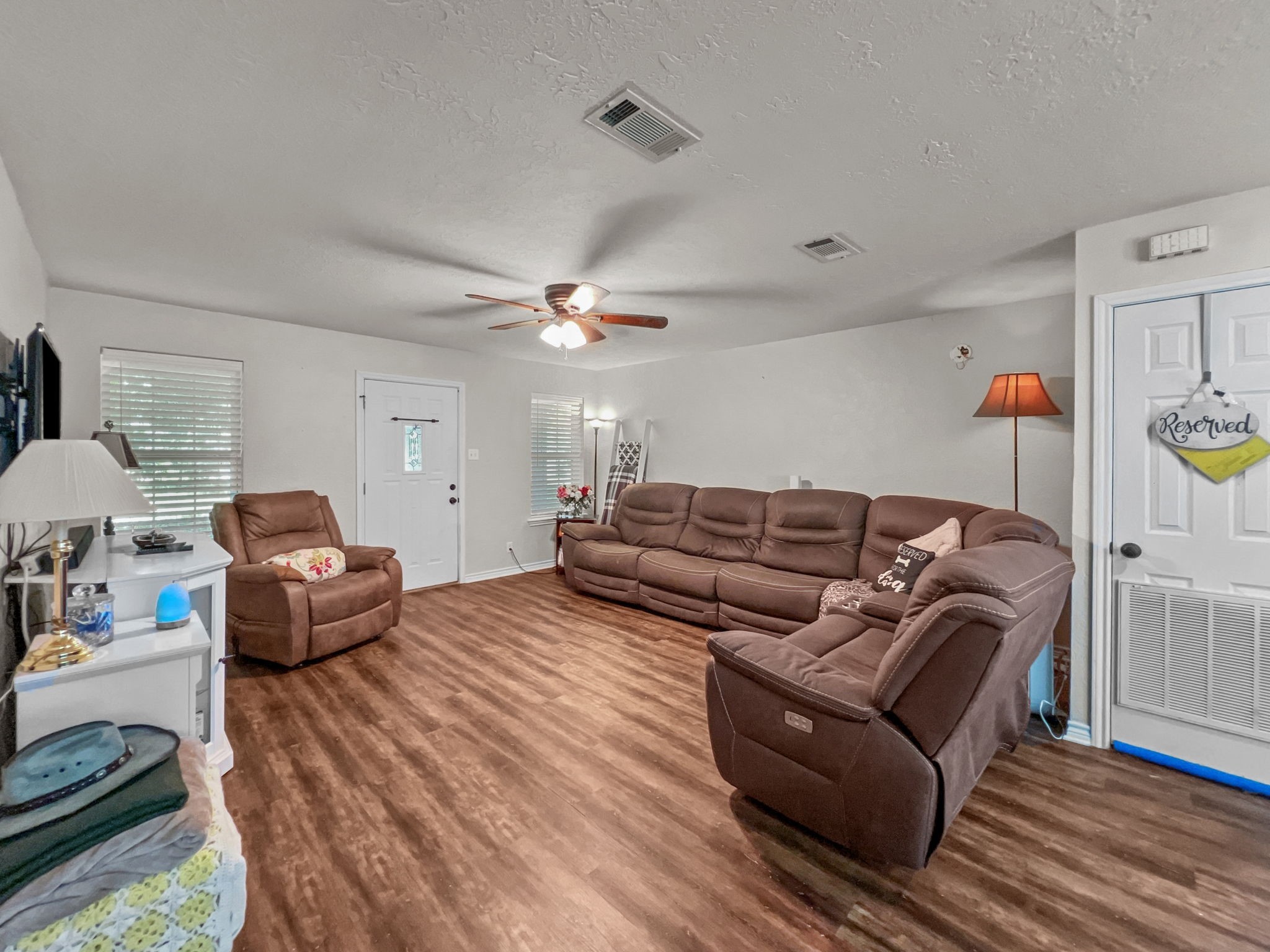 1015 Mitchell Street Sour Lake, TX 77659 - Photo 5 of 19 a living room with furniture and a chandelier