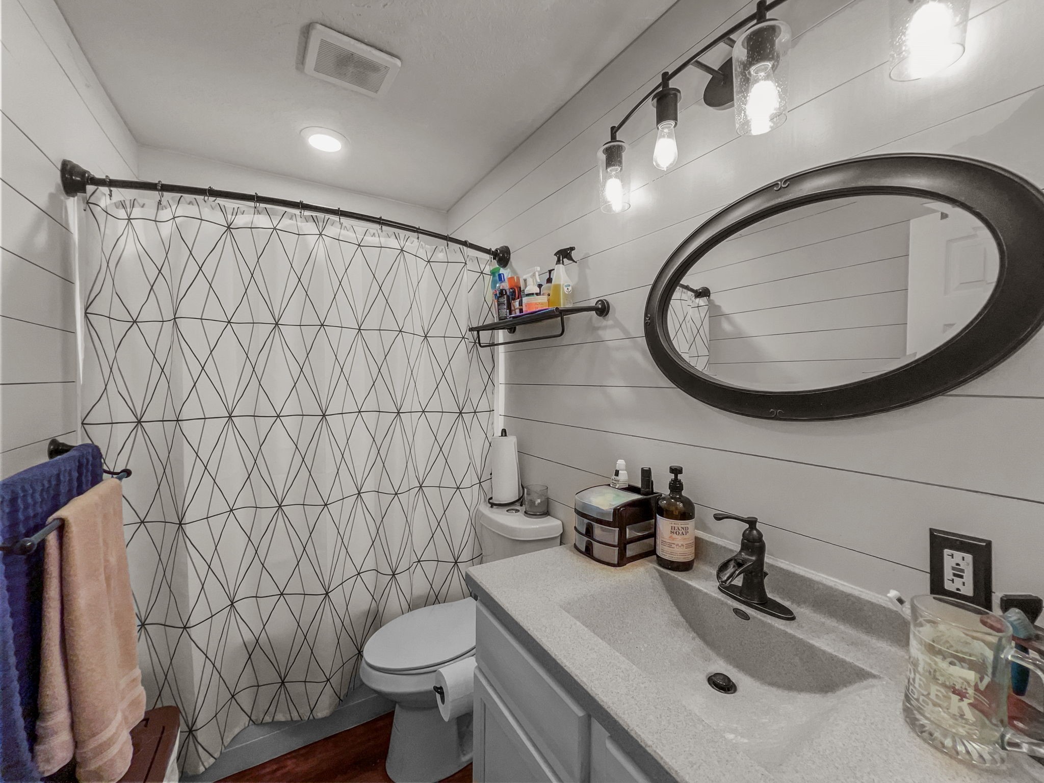 1015 Mitchell Street Sour Lake, TX 77659 - Photo 8 of 19 a bathroom with a sink mirror vanity and toilet