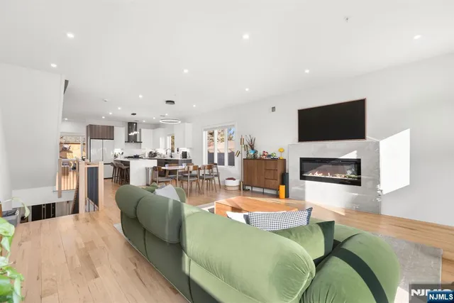 a living room with fireplace furniture and a flat screen tv