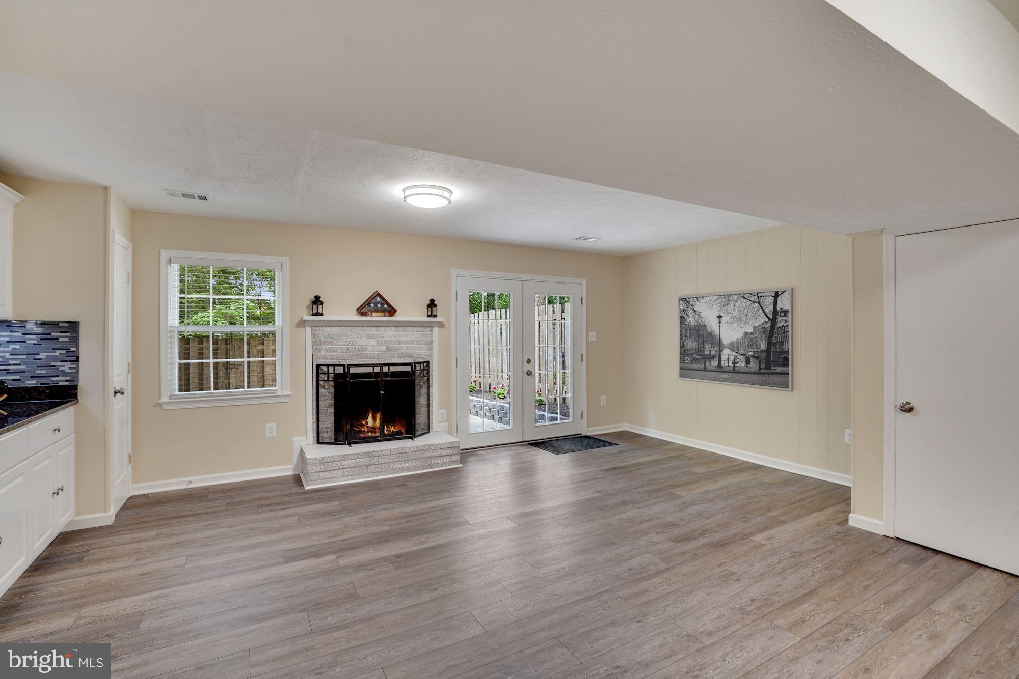 8014 Sleepy View Lane Springfield, VA 22153 - Photo 26 of 35 Wood burning Fireplace in family room.