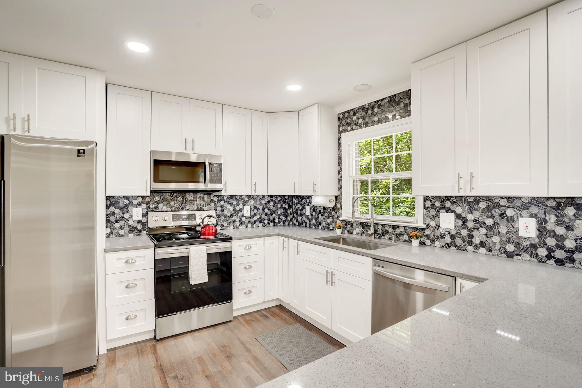 8014 Sleepy View Lane Springfield, VA 22153 - Photo 9 of 35 Updated Kitchen with stainless steel appliances.