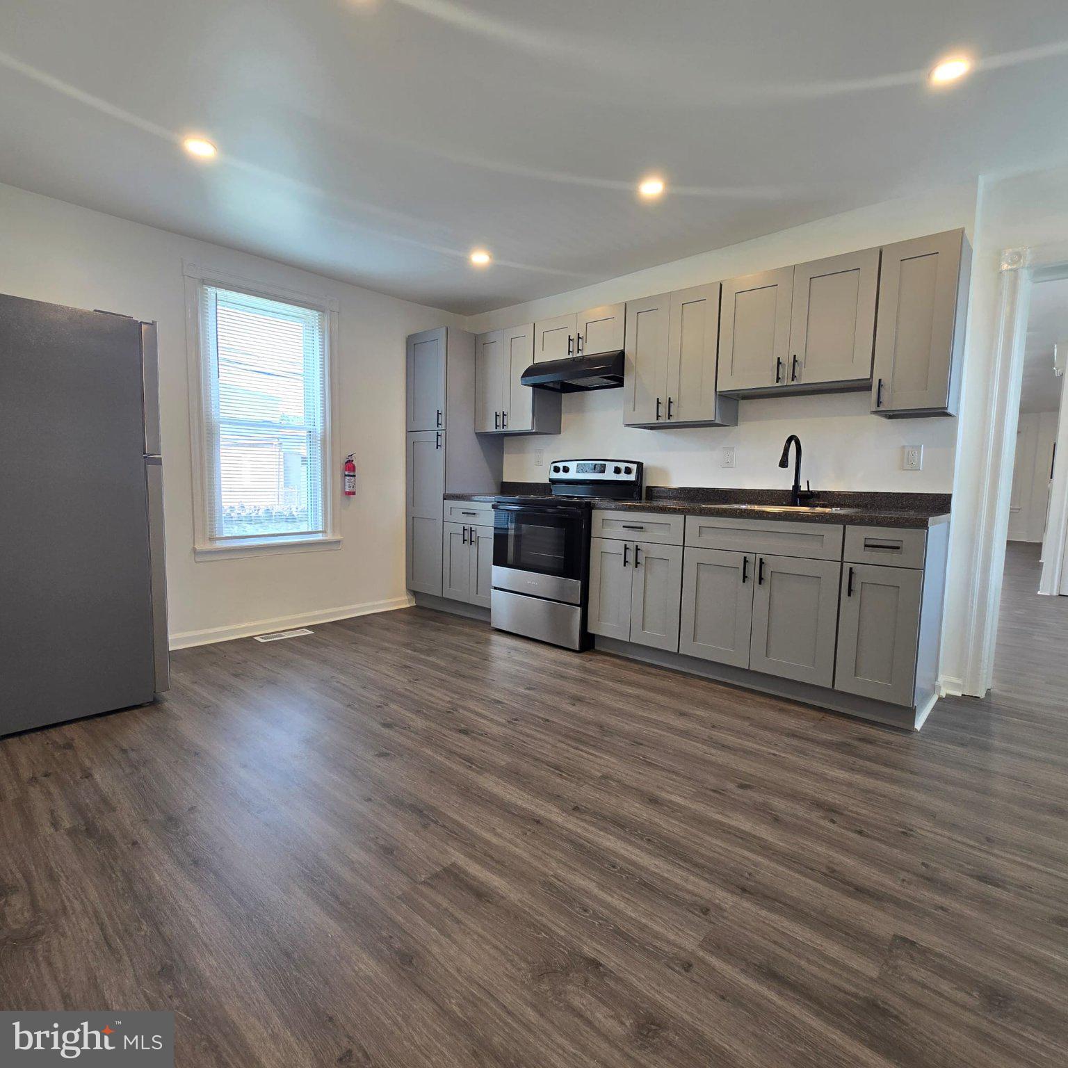 220 Irving Street Trainer, PA 19061 - Photo 6 of 25 Modern kitchen with sleek finishes.