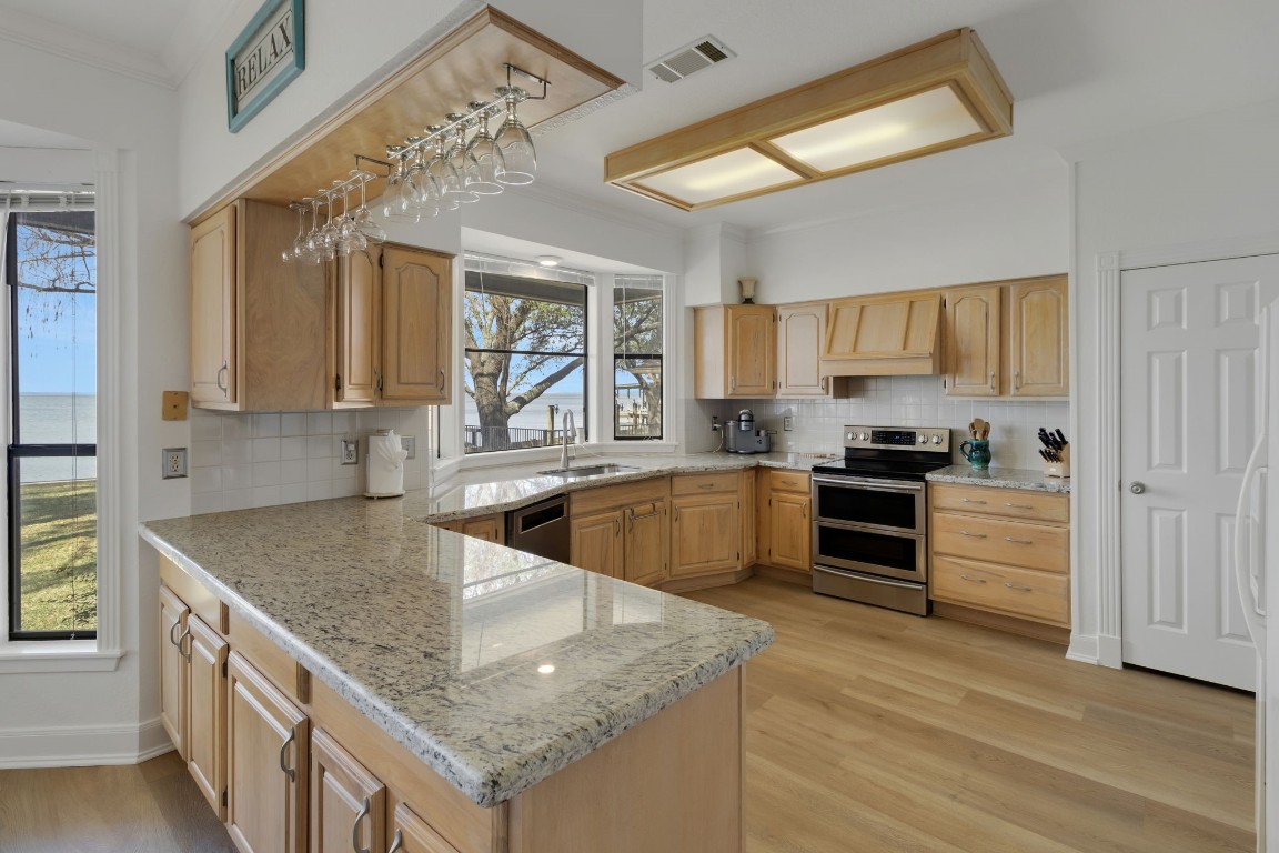 40 Pebble Beach Circle Coldspring, TX 77331 - Photo 14 of 50 The kitchen features granite countertops, lots of storage and pantry