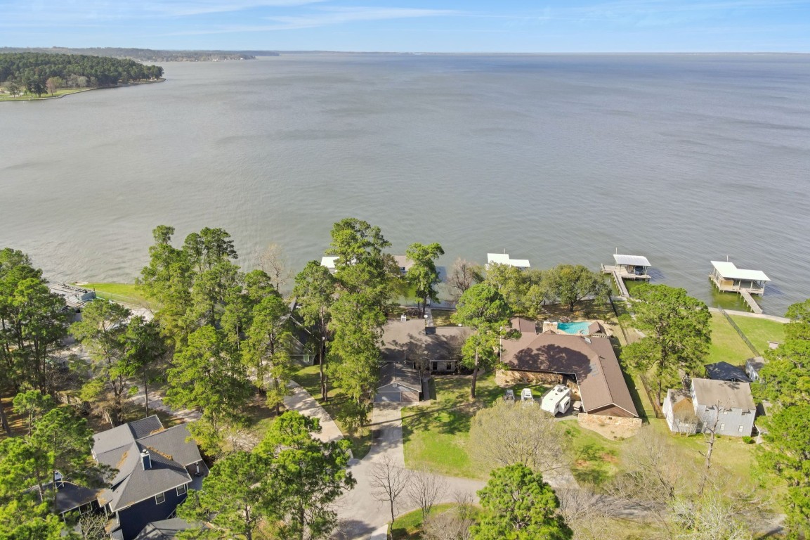 40 Pebble Beach Circle Coldspring, TX 77331 - Photo 4 of 50 Positioned on the open water and nestled amongst the trees you get the benefit of sun and shade