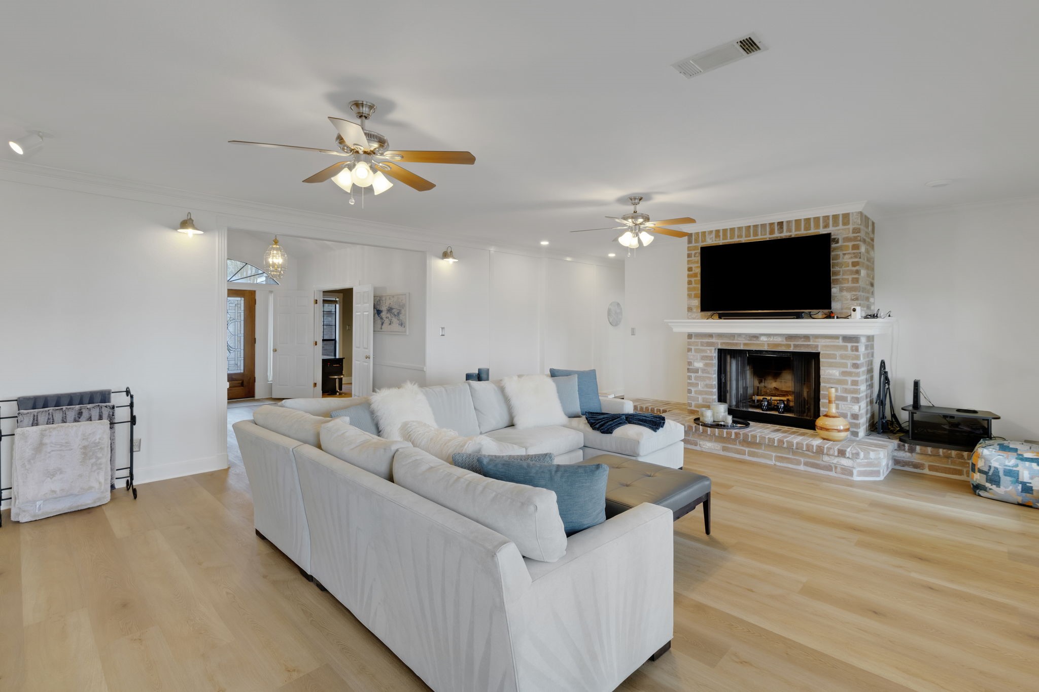 40 Pebble Beach Circle Coldspring, TX 77331 - Photo 9 of 50 The wood-burning fireplace with brick surround adds warmth and character, perfect for relaxing during the winter months