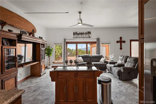 a living room with fireplace furniture and a window