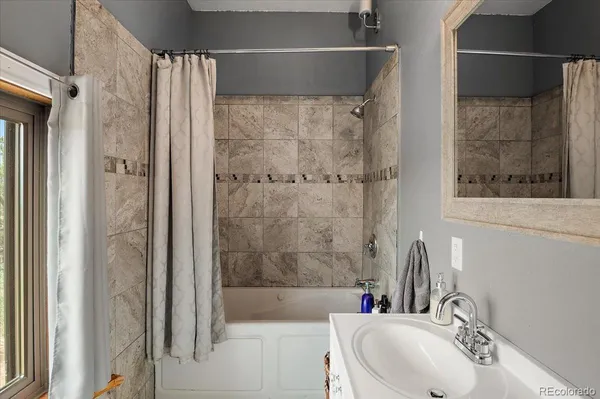 a bathroom with a sink and a bathtub