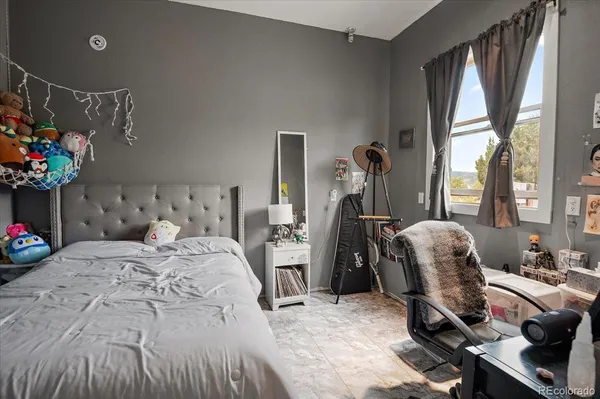 a bedroom with furniture and a bed