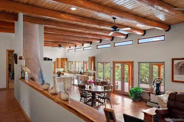 a view of a dining room with furniture window and outside view