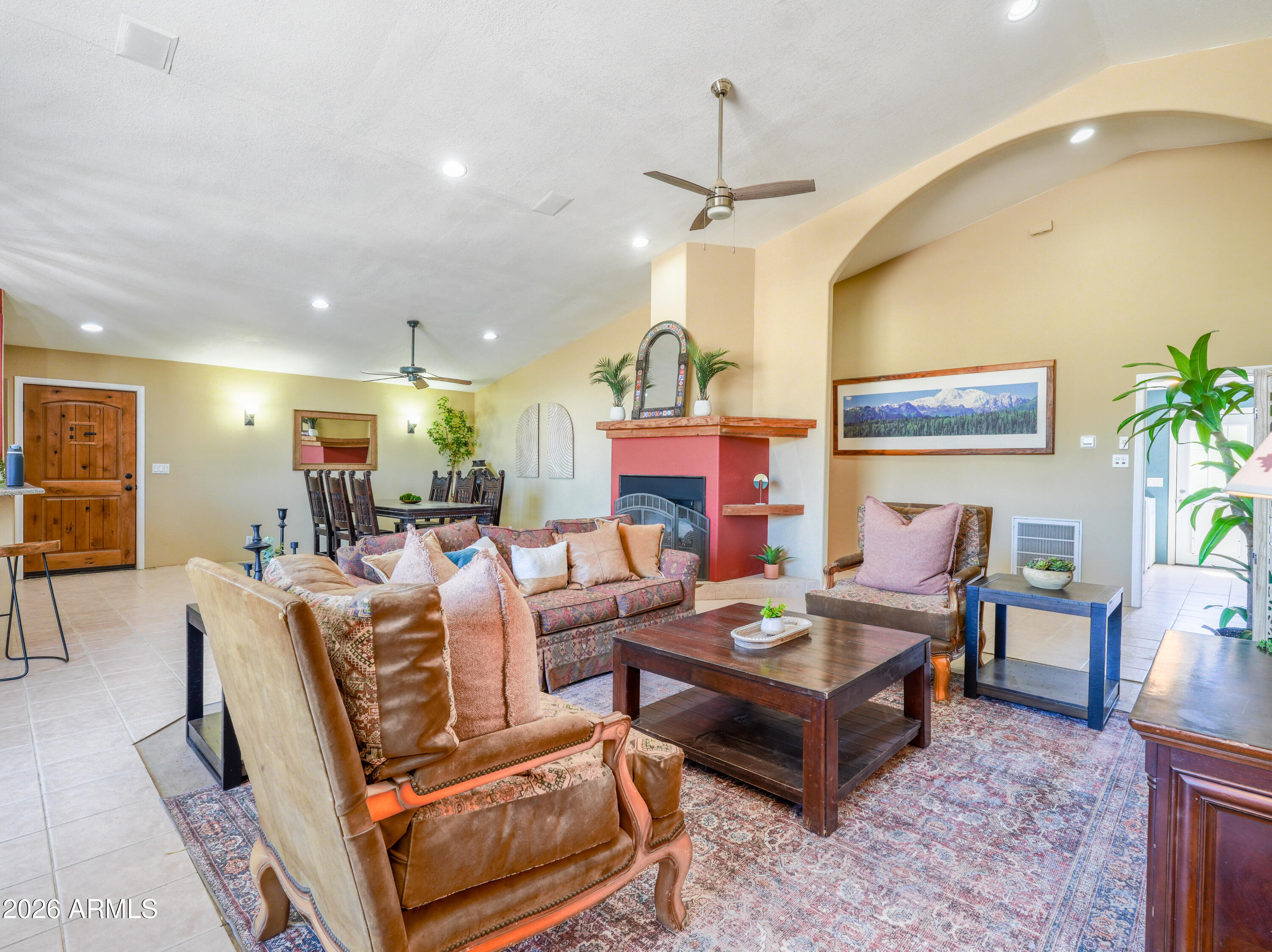 1224 North Acacia Road Apache Junction, AZ 85119 - Photo 12 of 48 a living room with fireplace furniture and a chandelier