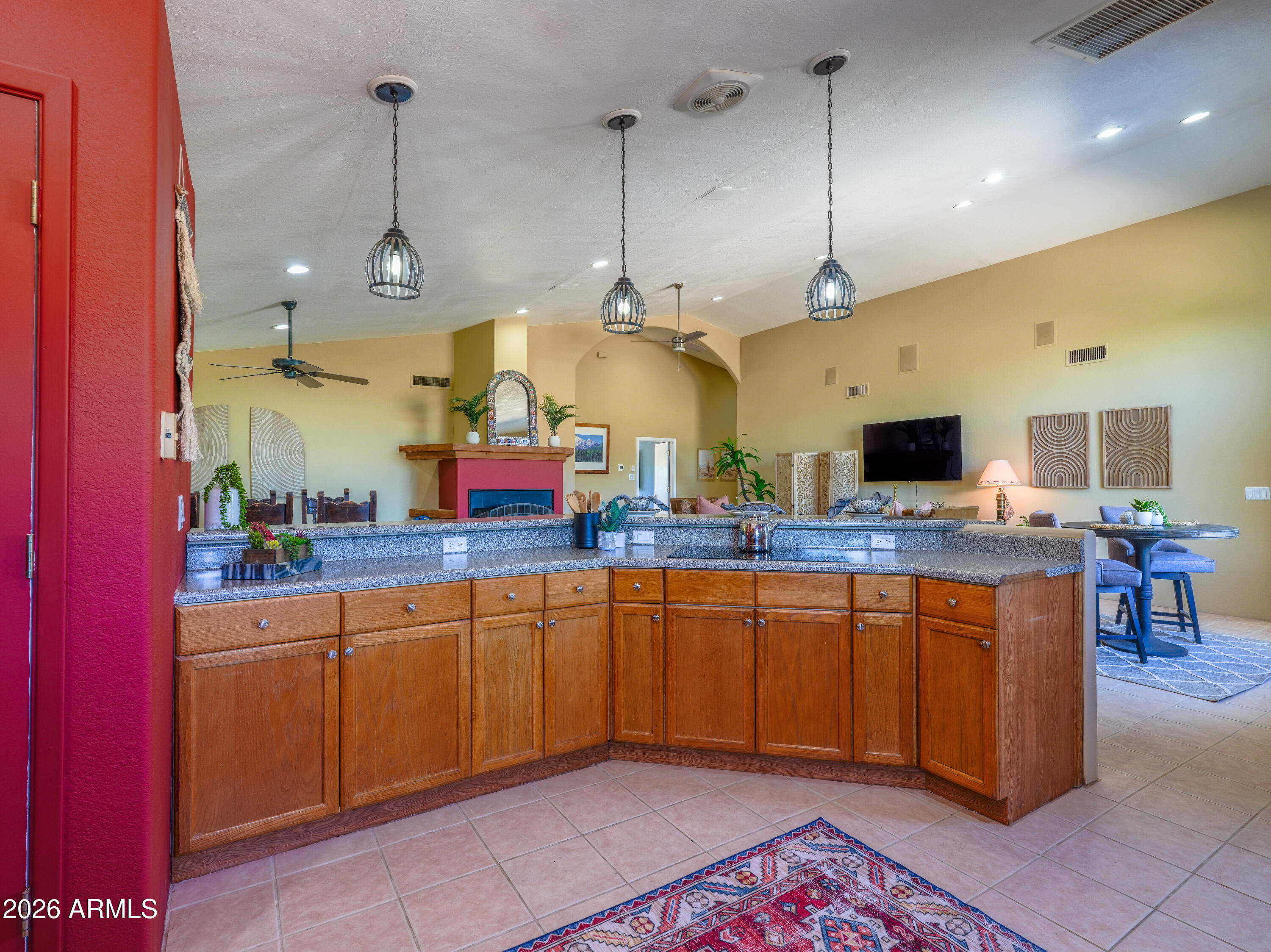 1224 North Acacia Road Apache Junction, AZ 85119 - Photo 14 of 48 a kitchen with stainless steel appliances granite countertop a sink a stove and a wooden cabinets