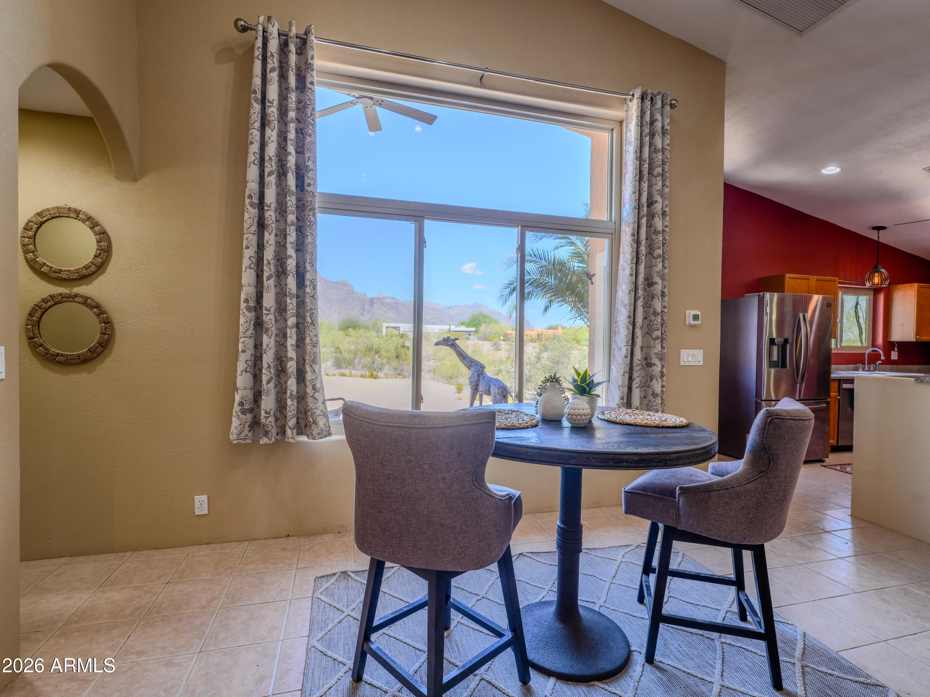 1224 North Acacia Road Apache Junction, AZ 85119 - Photo 17 of 48 a dining room with furniture and a window