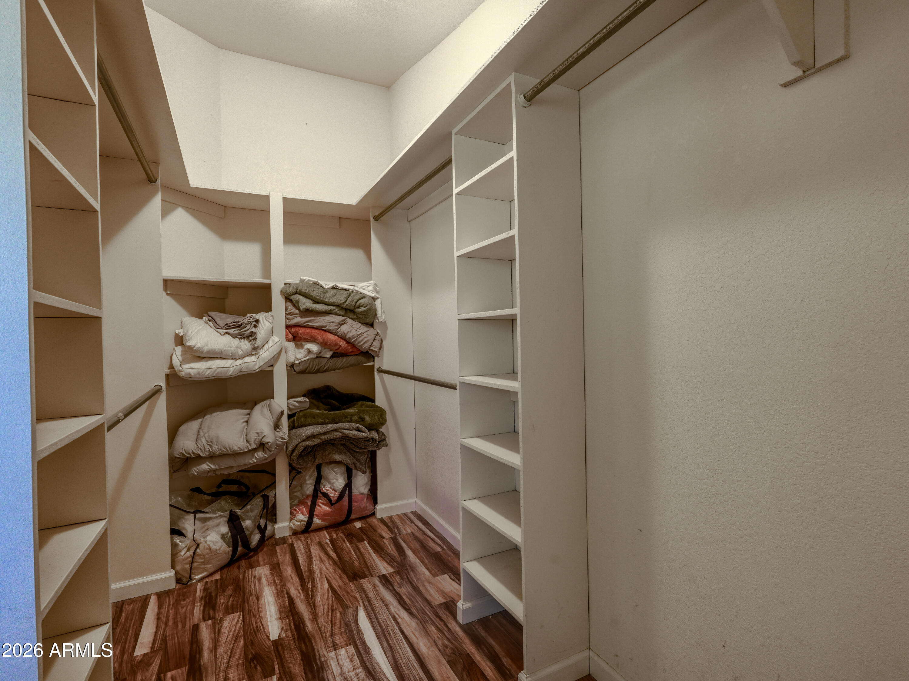 1224 North Acacia Road Apache Junction, AZ 85119 - Photo 26 of 48 a view of walk in closet with clothes and shoes
