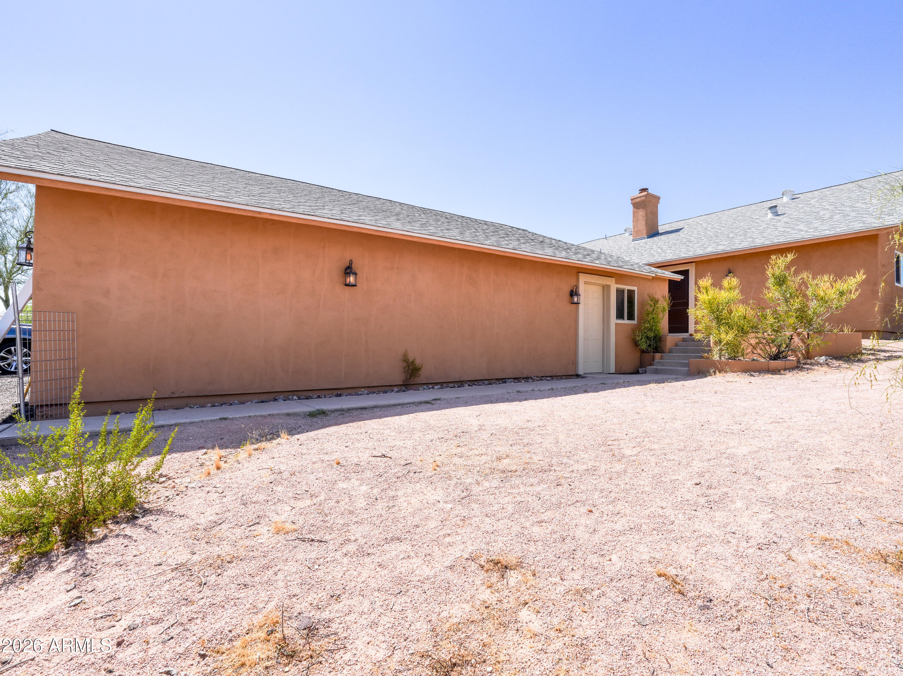 1224 North Acacia Road Apache Junction, AZ 85119 - Photo 8 of 48 a view of a backyard of a house
