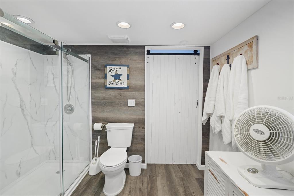 Undisclosed Address Holiday, FL 34691 - Photo 14 of 32 a bathroom with a sink toilet and shower