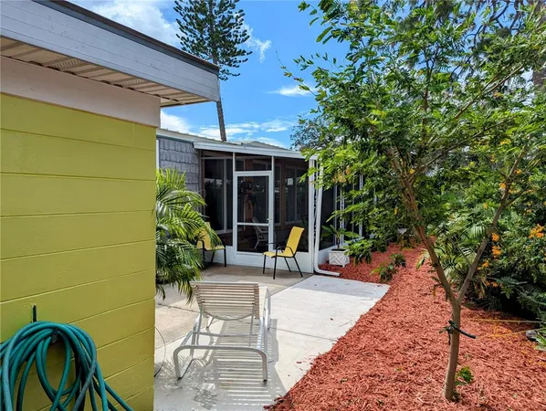 a bench is sitting in front of a house