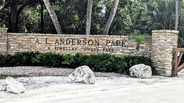 a view of a wooden bench next to a road