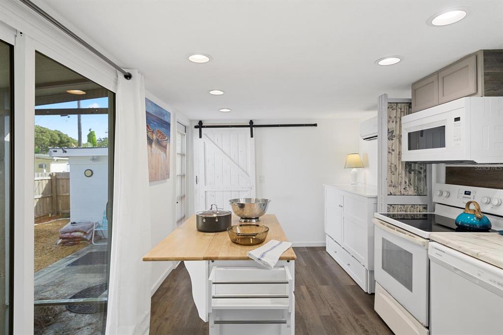 Undisclosed Address Holiday, FL 34691 - Photo 9 of 32 a kitchen with a sink and cabinets