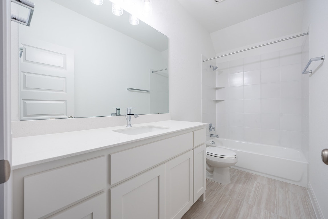 228 Running Fawn Georgetown, TX 78628 - Photo 19 of 29 a bathroom with a sink a toilet and shower