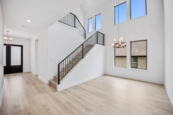 a view of an entryway with wooden floor