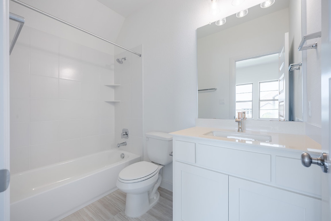 228 Running Fawn Georgetown, TX 78628 - Photo 21 of 29 a bathroom with a sink a toilet and shower