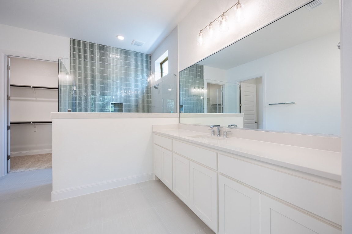 228 Running Fawn Georgetown, TX 78628 - Photo 9 of 29 a bathroom with a double vanity sink and mirror